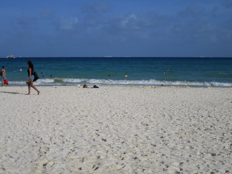 White sand, blue water, beautiful girls passing by â€¦